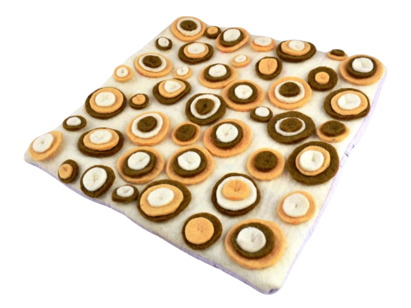 Soft felt cushion in muted earth tones